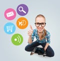 Smiling teen girl sitting on floor with tablet pc Royalty Free Stock Photo