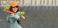 smiling teen kid skater with skateboard outdoor. girl with penny board. hipster girl with longboard