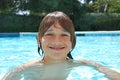 Smiling Teenage Boy Swimming in Pool Royalty Free Stock Photo