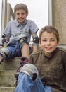 Smiling teenage boys in roller-blading protection kits