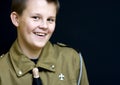 Smiling teenage boyscout