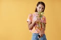 Smiling teenage girl with cerebral palsy holding lily flower Royalty Free Stock Photo