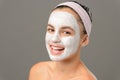 Smiling teenage girl face mask bare shoulders Royalty Free Stock Photo