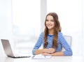 Smiling teenage girl laptop computer and notebook Royalty Free Stock Photo