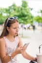 Smiling teenage girl with milkshake on summer day Royalty Free Stock Photo