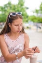 Smiling teenage girl with milkshake on summer day Royalty Free Stock Photo