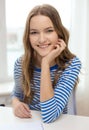 Smiling teenage girl with notebook at home Royalty Free Stock Photo