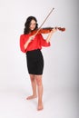 Smiling teenage girl playing violin Royalty Free Stock Photo