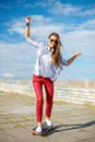 Smiling teenage girl riding skate outside Royalty Free Stock Photo