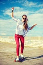 Smiling teenage girl riding skate outside Royalty Free Stock Photo