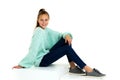 Smiling teenage girl sitting on floor Royalty Free Stock Photo