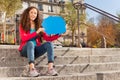 Smiling teenage girl with empty speech cloud