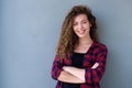 Smiling teenage girl standing with arms crossed Royalty Free Stock Photo