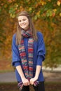 Smiling Teenage Girl Standing In Autumn Park Royalty Free Stock Photo