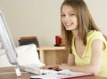 Smiling Teenage Girl Studying at Home Royalty Free Stock Photo