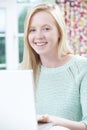 Smiling Teenage Girl Using Laptop At Home Royalty Free Stock Photo