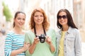 Smiling teenage girls with camera Royalty Free Stock Photo