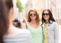 Smiling teenage girls with camera Royalty Free Stock Photo