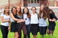 Smiling Teenage Girls front of the School Royalty Free Stock Photo