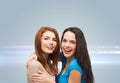 Smiling teenage girls hugging Royalty Free Stock Photo