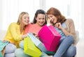 Smiling teenage girls with many shopping bags Royalty Free Stock Photo