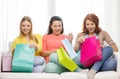 Smiling teenage girls with many shopping bags Royalty Free Stock Photo