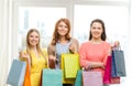 Smiling teenage girls with many shopping bags Royalty Free Stock Photo