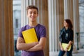 Smiling teenage student outdoors