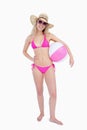 Smiling teenager in beachwear holding a beach ball Royalty Free Stock Photo