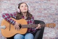 Smiling teenager girl playing acoustic guitar Royalty Free Stock Photo
