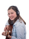 Smiling teenager girl playing acoustic guitar on white Royalty Free Stock Photo