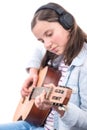 Smiling teenager girl playing acoustic guitar on white Royalty Free Stock Photo
