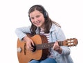 Smiling teenager girl playing acoustic guitar on white Royalty Free Stock Photo