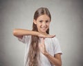 Smiling teenager girl showing time out gesture