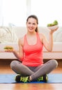 Smiling teenager with green salad and hamburger Royalty Free Stock Photo