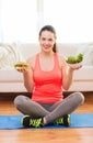 Smiling teenager with green salad and hamburger Royalty Free Stock Photo