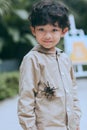 Smiling teenager and his pet a tarantula Royalty Free Stock Photo