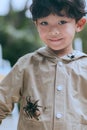 Smiling teenager and his pet a tarantula Royalty Free Stock Photo