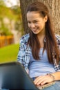 Smiling teenager with laptop Royalty Free Stock Photo