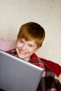 Smiling teenager with a laptop Royalty Free Stock Photo