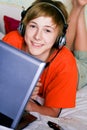 Smiling teenager with a laptop