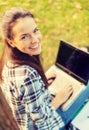 Smiling teenager with laptop Royalty Free Stock Photo