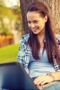 Smiling teenager with laptop Royalty Free Stock Photo