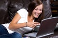 Smiling Teenager Looking at the Computer