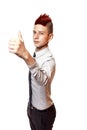 A smiling teenager with red mohawk wearing shirt and tie shows his thumb up isolated on the white background