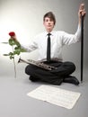 Smiling teenager with trumpet and rose. Music and sound concept.