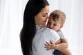 smiling tender mother holding cute baby boy Royalty Free Stock Photo