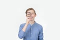 Smiling tennager with magnifying glass on white background. Curious Teenager with Magnifying Glass Isolated on the White