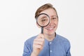 Smiling tennager with magnifying glass on white background. Curious Teenager with Magnifying Glass Isolated on the White