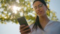 Smiling thoughtful woman businesswoman client girl student business lady wearing glasses send text message communicate Royalty Free Stock Photo